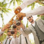 Men having a toast with beer at a bachelor party.