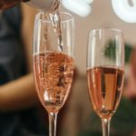 Close-Up Photo of Rosé Wine in Champagne Glasses