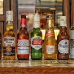 Assorted Glass Bottles Of Beers on wooden surface