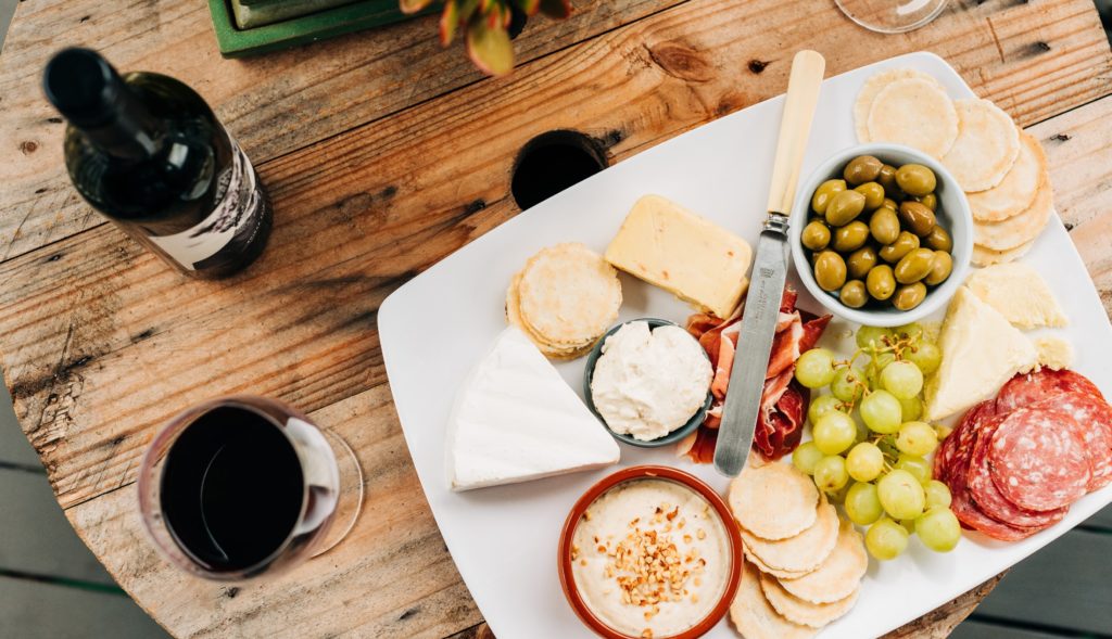 Wine and cheese pairing guide from Saucey. Photo by Melissa Walker Horn on Unsplash