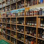Shelves of wine and spirits inside a licensed liquor store, the kind of retailer that fulfills alcohol delivery orders